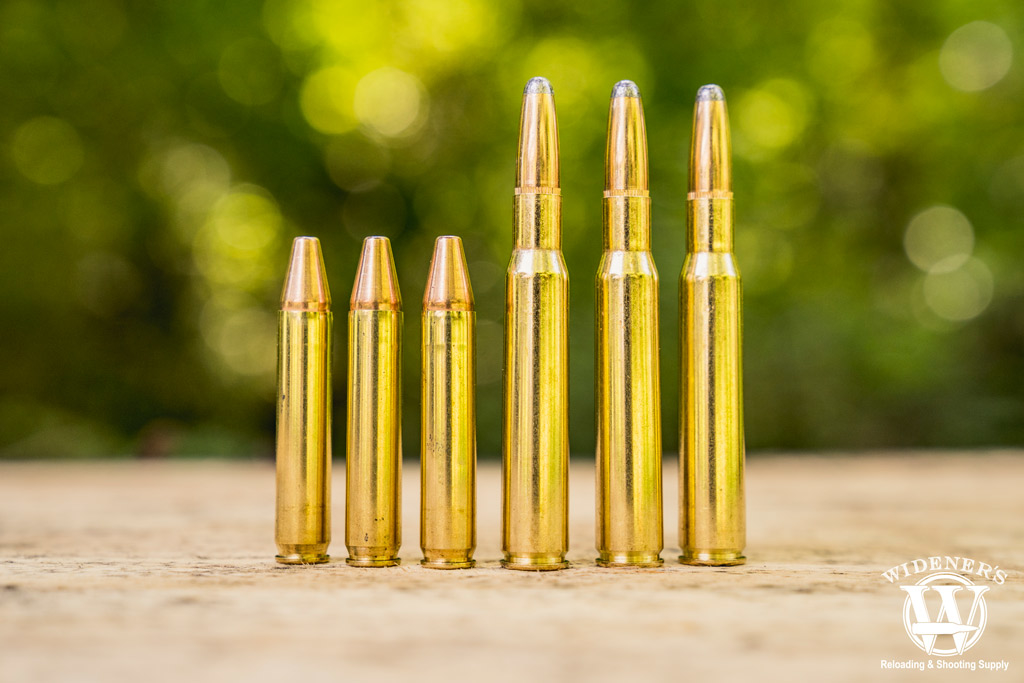 a photo of 350 legend ammo next to 30-06 ammo outdoors