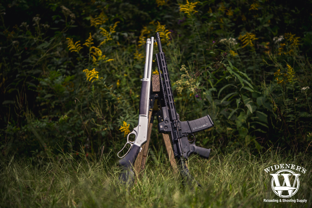 a photo of a lever action rifle and an AR rifle 45-70 VS 450 Bushmaster